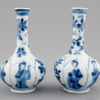 A pair of Chinese blue and white bottle shaped vases with long Elizas, Kangxi